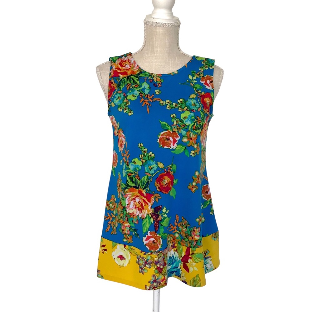 Coco Bianca vibrant colored loose fitter too I’m size small with bow in the bac